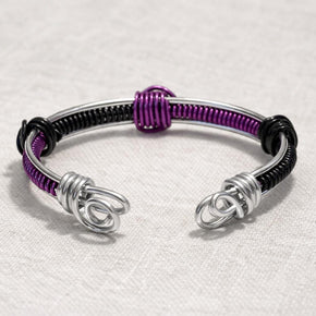 Bracciale rigido unisex regolabile in alluminio antiallergico nero e viola|Bracciale artigianale minimal con spirali|Idea regalo uomo donna